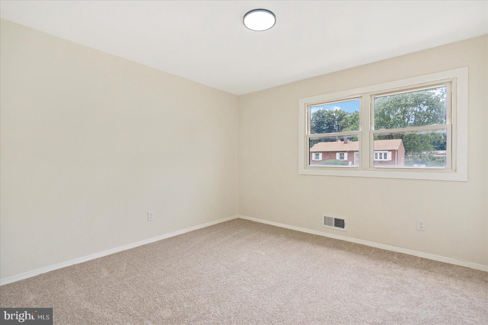 6726 Longhill Road Baltimore, MD 21207 - Photo 26 of 36 an empty room with windows