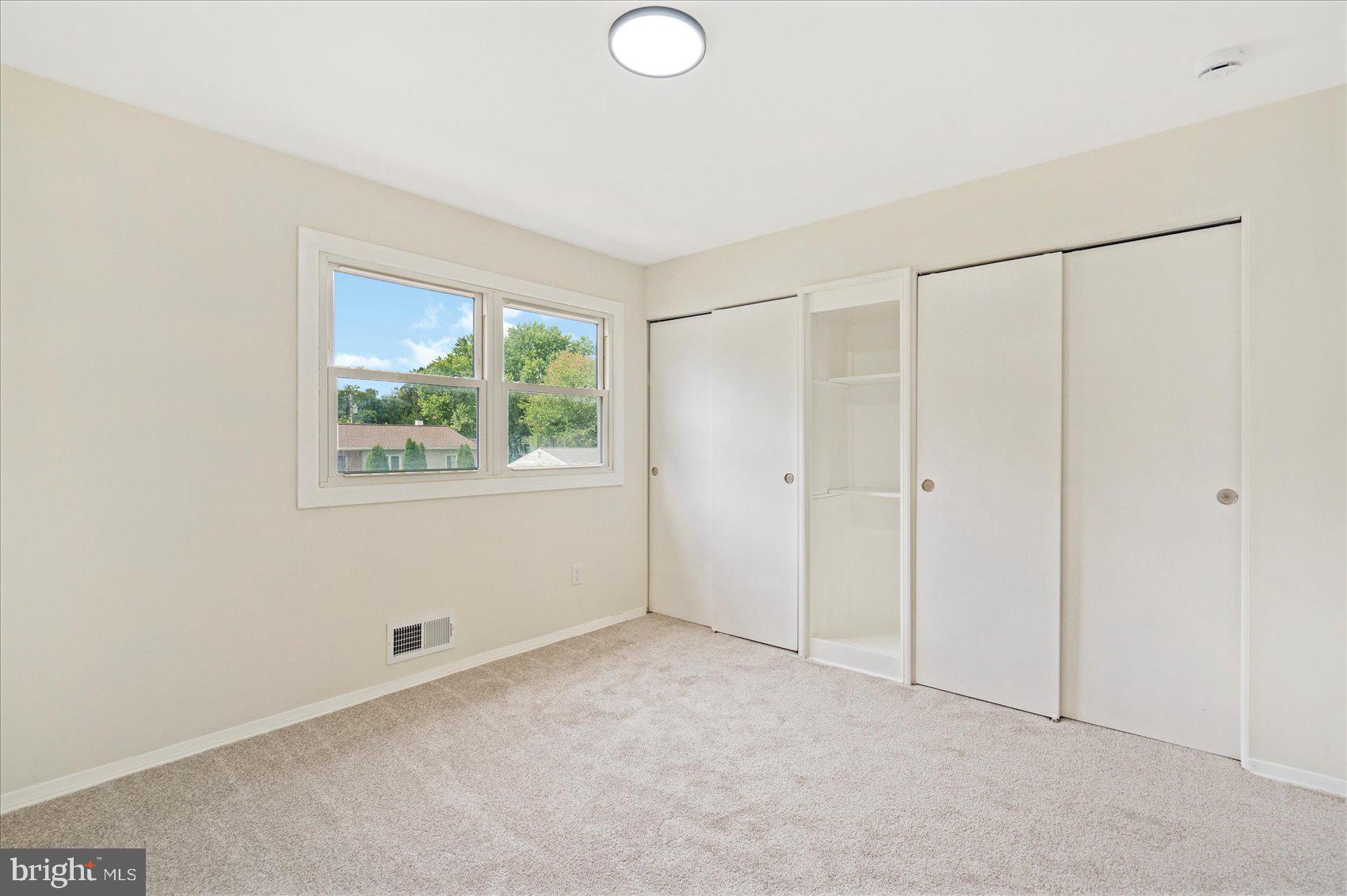 6726 Longhill Road Baltimore, MD 21207 - Photo 28 of 36 a view of an empty room with a window