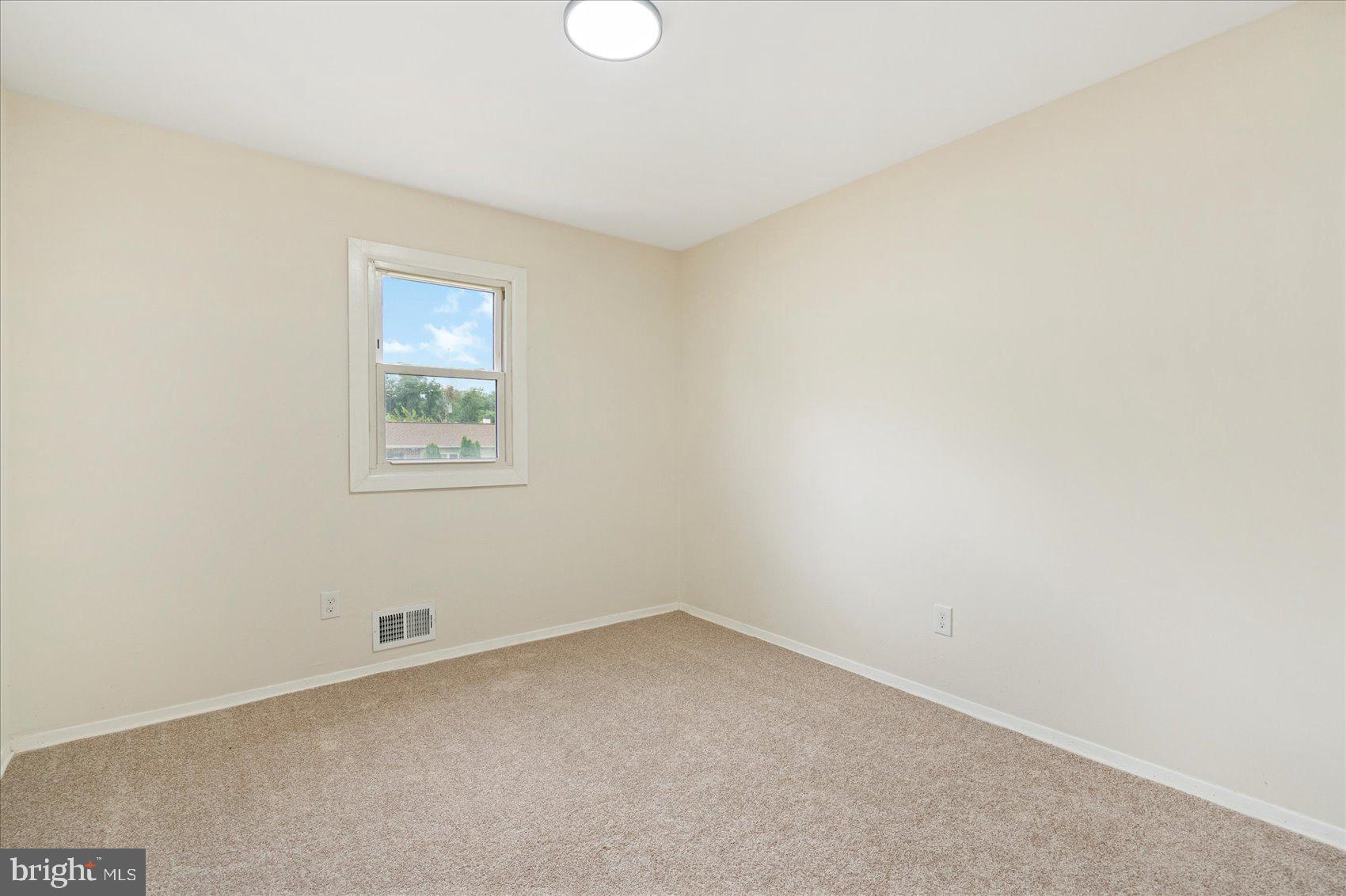 6726 Longhill Road Baltimore, MD 21207 - Photo 29 of 36 an empty room with a window