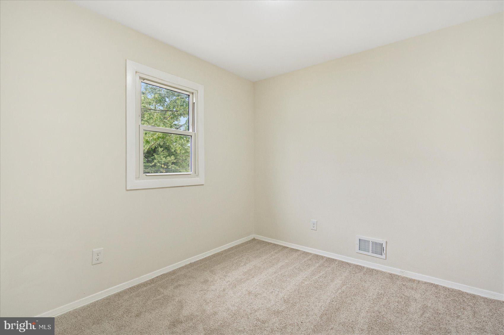 6726 Longhill Road Baltimore, MD 21207 - Photo 31 of 36 an empty room with a window