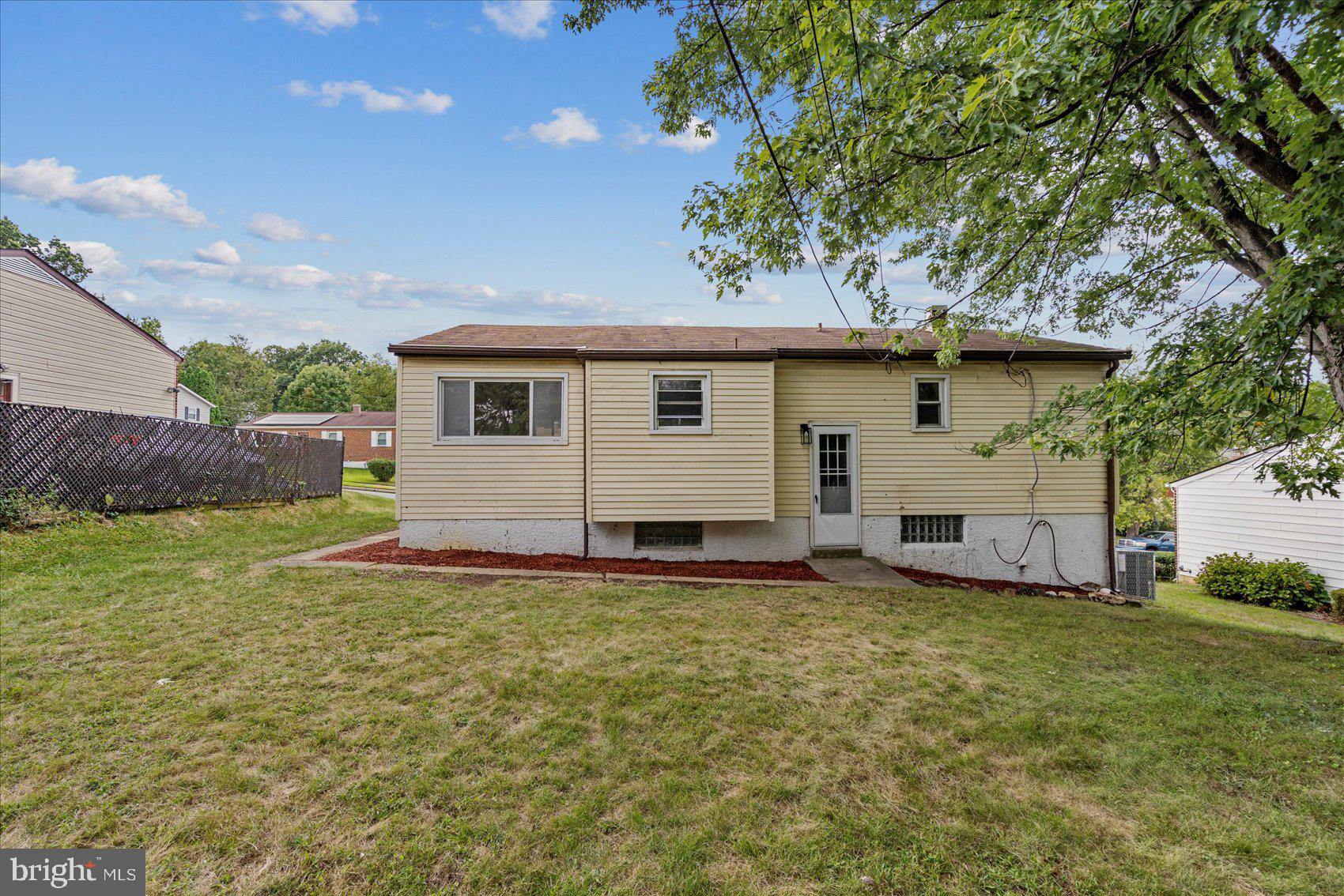 6726 Longhill Road Baltimore, MD 21207 - Photo 5 of 36 a view of a house with a yard