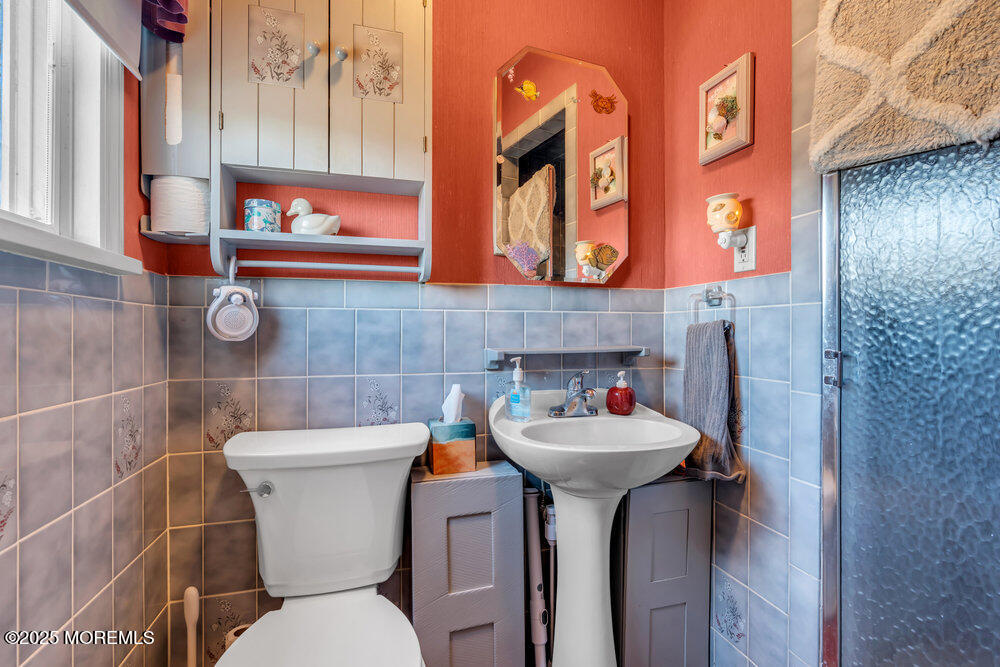 64 Sunset Drive Howell, NJ 07731 - Photo 18 of 24 a bathroom with a sink and a mirror