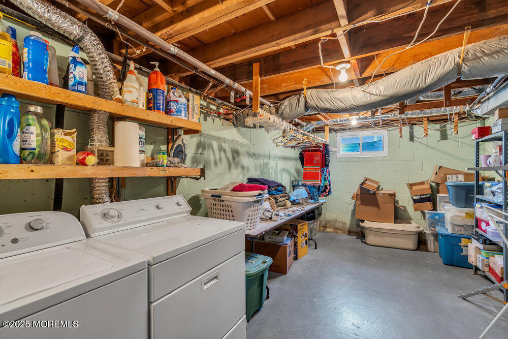 64 Sunset Drive Howell, NJ 07731 - Photo 21 of 24 a utility room with dryer and washer