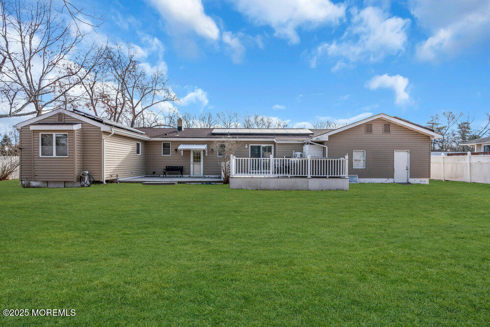64 Sunset Drive Howell, NJ 07731 - Photo 22 of 24 a view of a house with a big yard and large trees