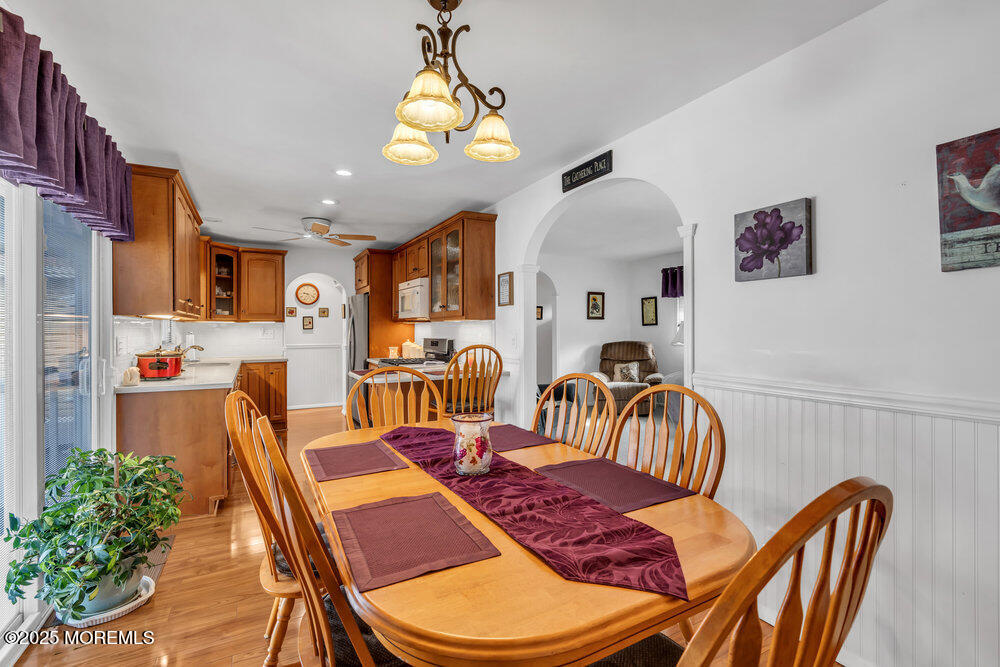 64 Sunset Drive Howell, NJ 07731 - Photo 9 of 24 a living room with furniture and a chandelier