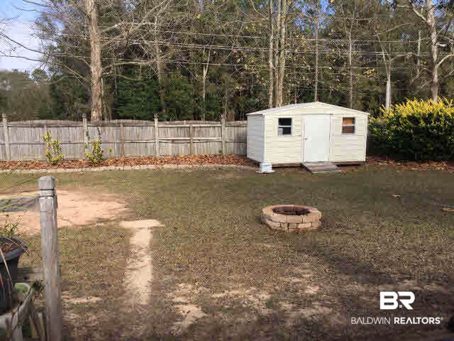 513 Orchard Lane Foley, AL 36535 - Photo 25 of 28 Backyard and storage