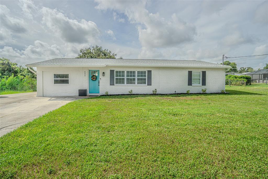 111 Ed Padgett Road Lakeland, FL 33809 - Photo 1 of 1 a front view of house with yard and green space