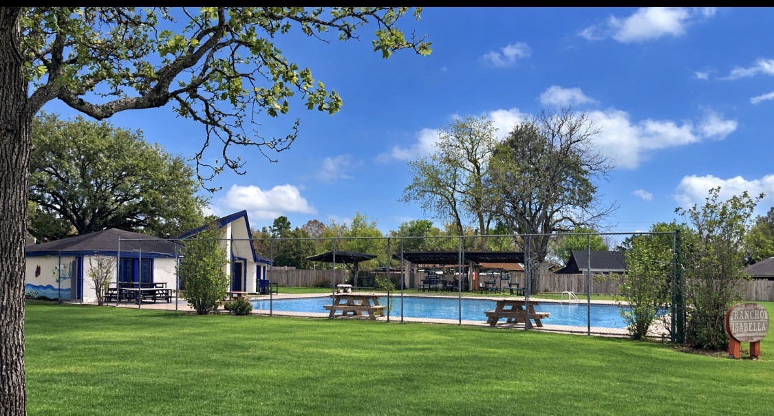 245 North Ranch House Road Angleton, TX 77515 - Photo 18 of 19 Enjoy exclusive access to a private neighborhood swimming pool, perfect for relaxing weekends or summer fun just steps from your door.