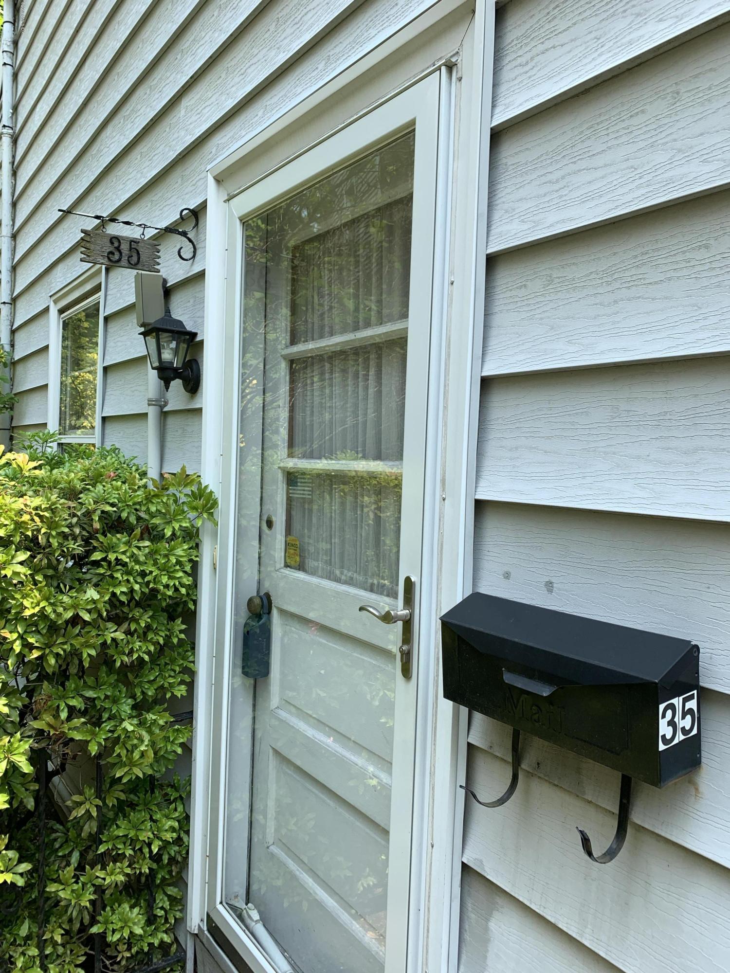 35 Sound View Drive Greenwich, CT 06830 - Photo 3 of 11 a balcony with table and chairs
