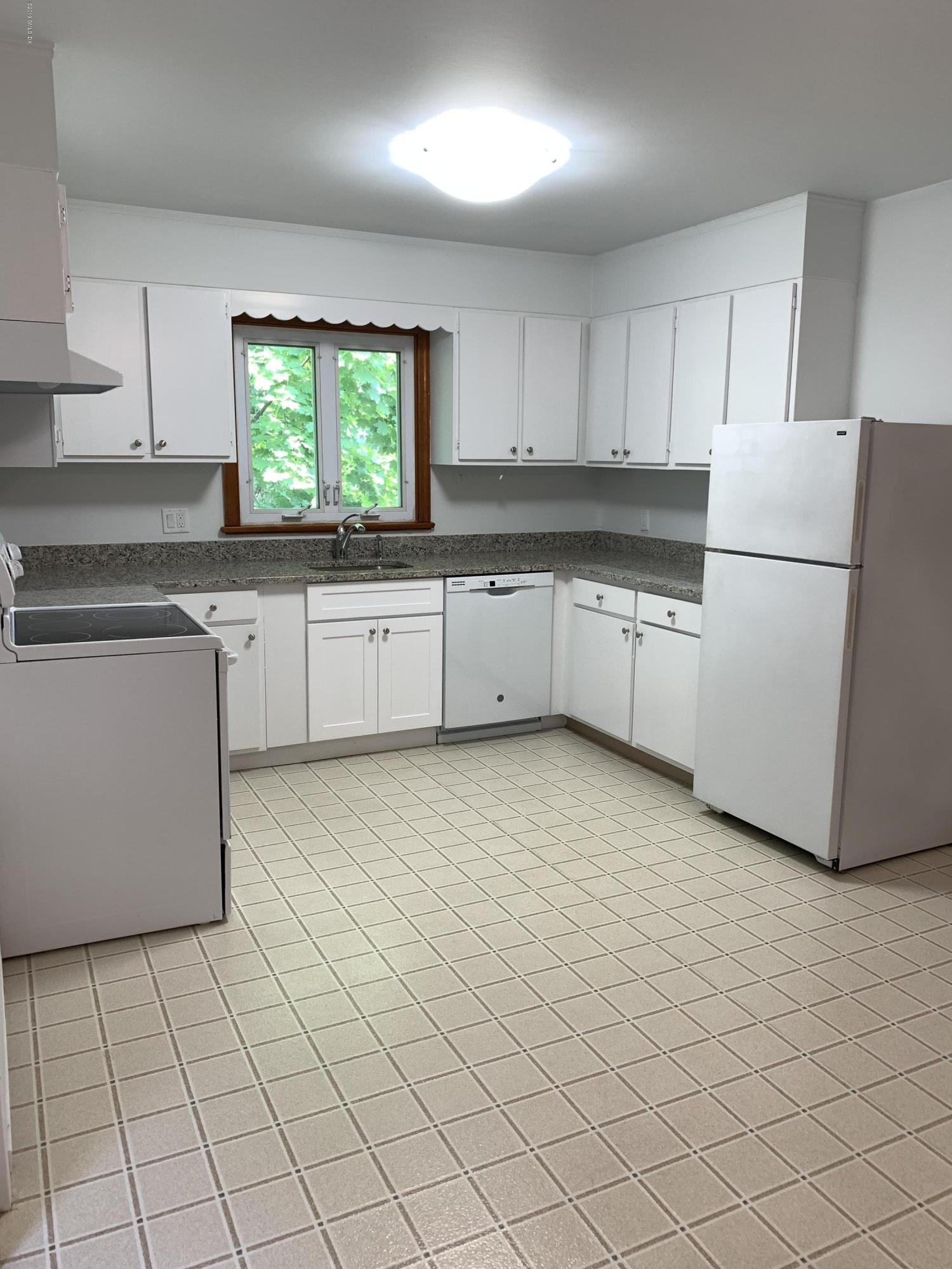 35 Sound View Drive Greenwich, CT 06830 - Photo 4 of 11 a kitchen with a cabinets a sink and a stove top oven