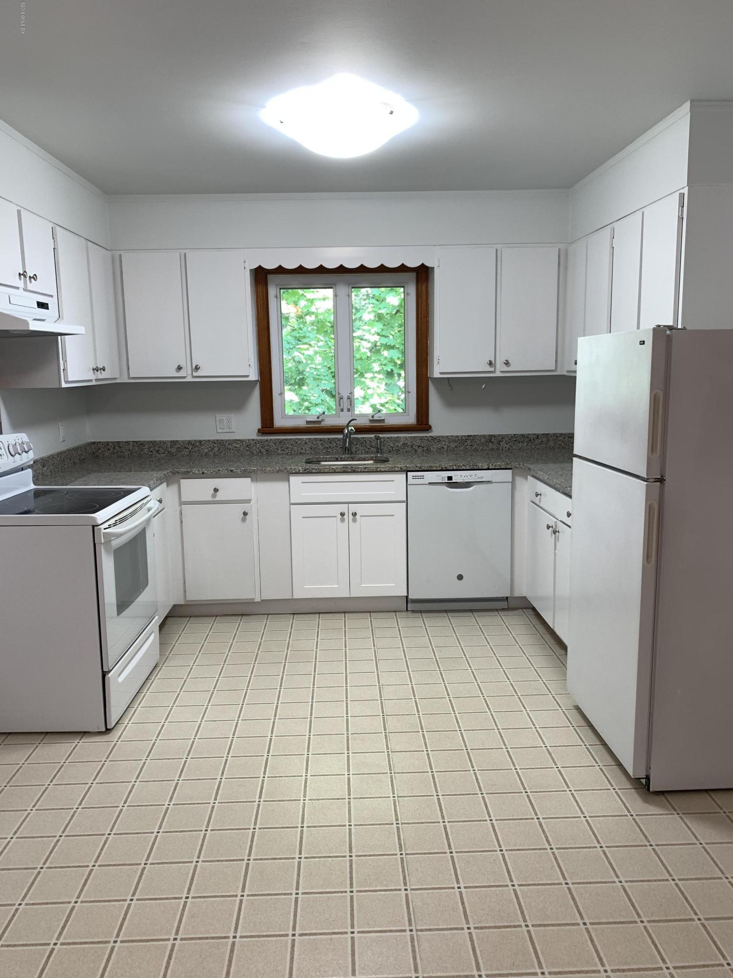 35 Sound View Drive Greenwich, CT 06830 - Photo 5 of 11 a kitchen with stainless steel appliances granite countertop a refrigerator sink and cabinets