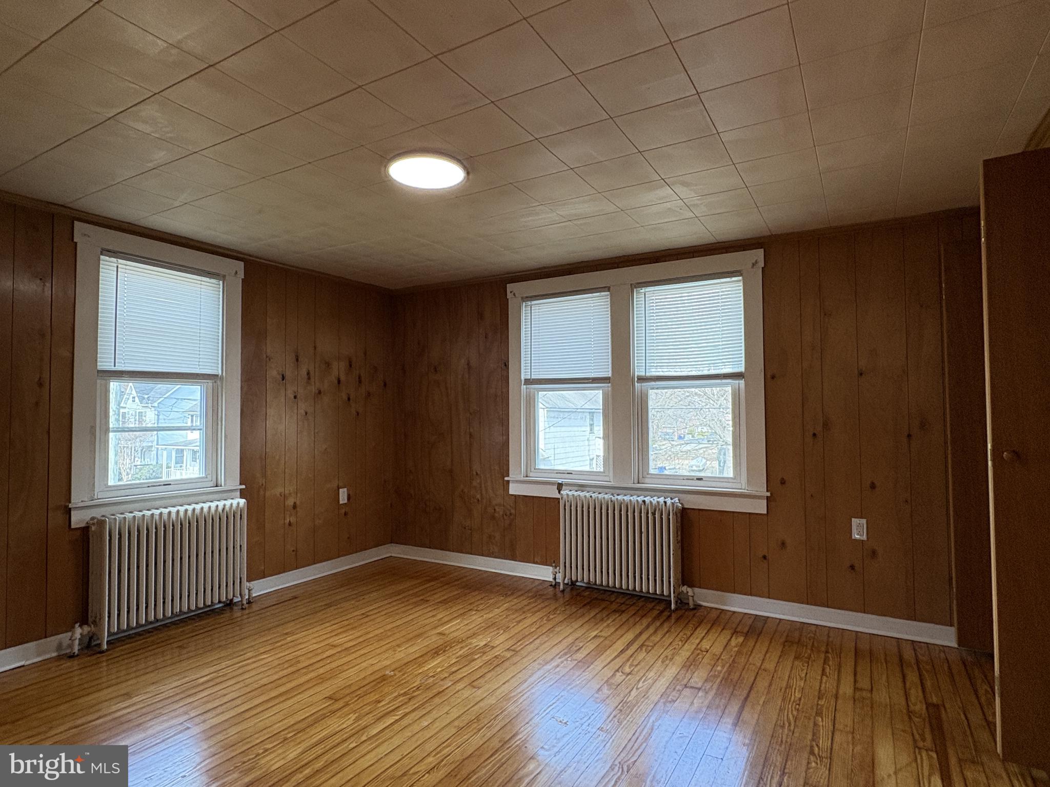 119 Maffitt Street, Unit 4 Elkton, MD 21921 - Photo 9 of 17 Good Size Primary Bedroom w/ Hardwood Floor