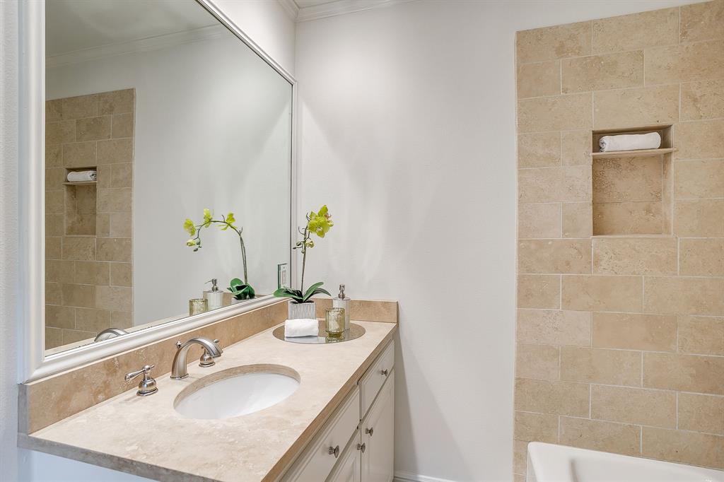 624 Edgefield Road Fort Worth, TX 76107 - Photo 28 of 37 a bathroom with a granite countertop sink and a mirror