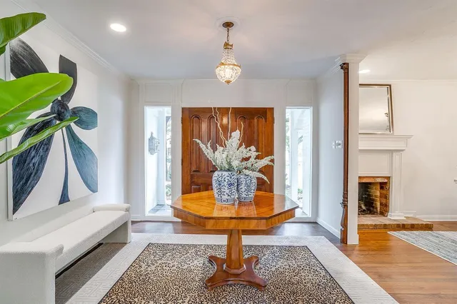 a view of living room with furniture and wooden floor