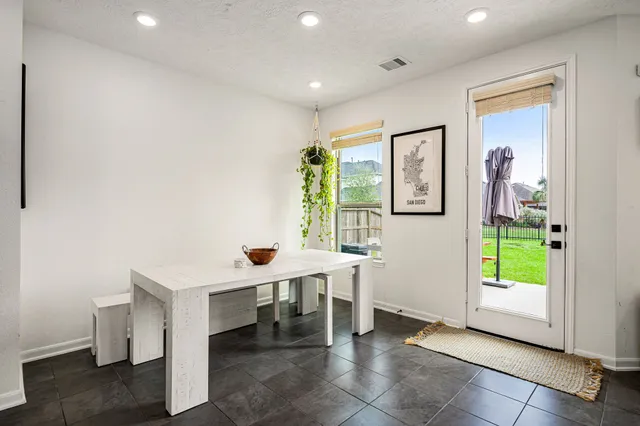 a view of a room with furniture and window