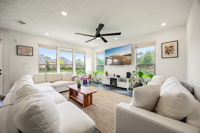 a living room with furniture and a large window