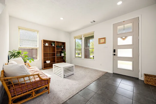 a living room with furniture and a window