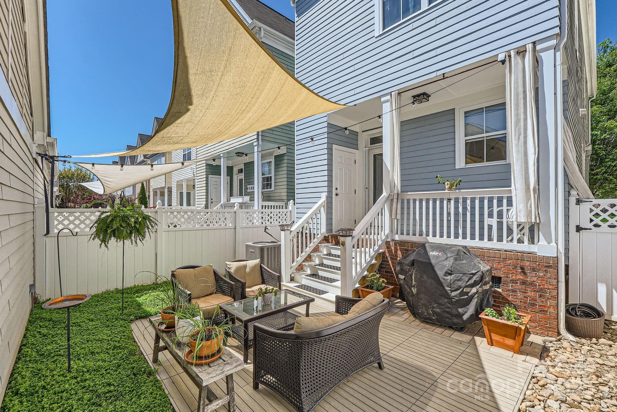 275 Bridges Farm Road Mooresville, NC 28115 - Photo 17 of 48 a view of a patio with couches table and chairs and potted plants