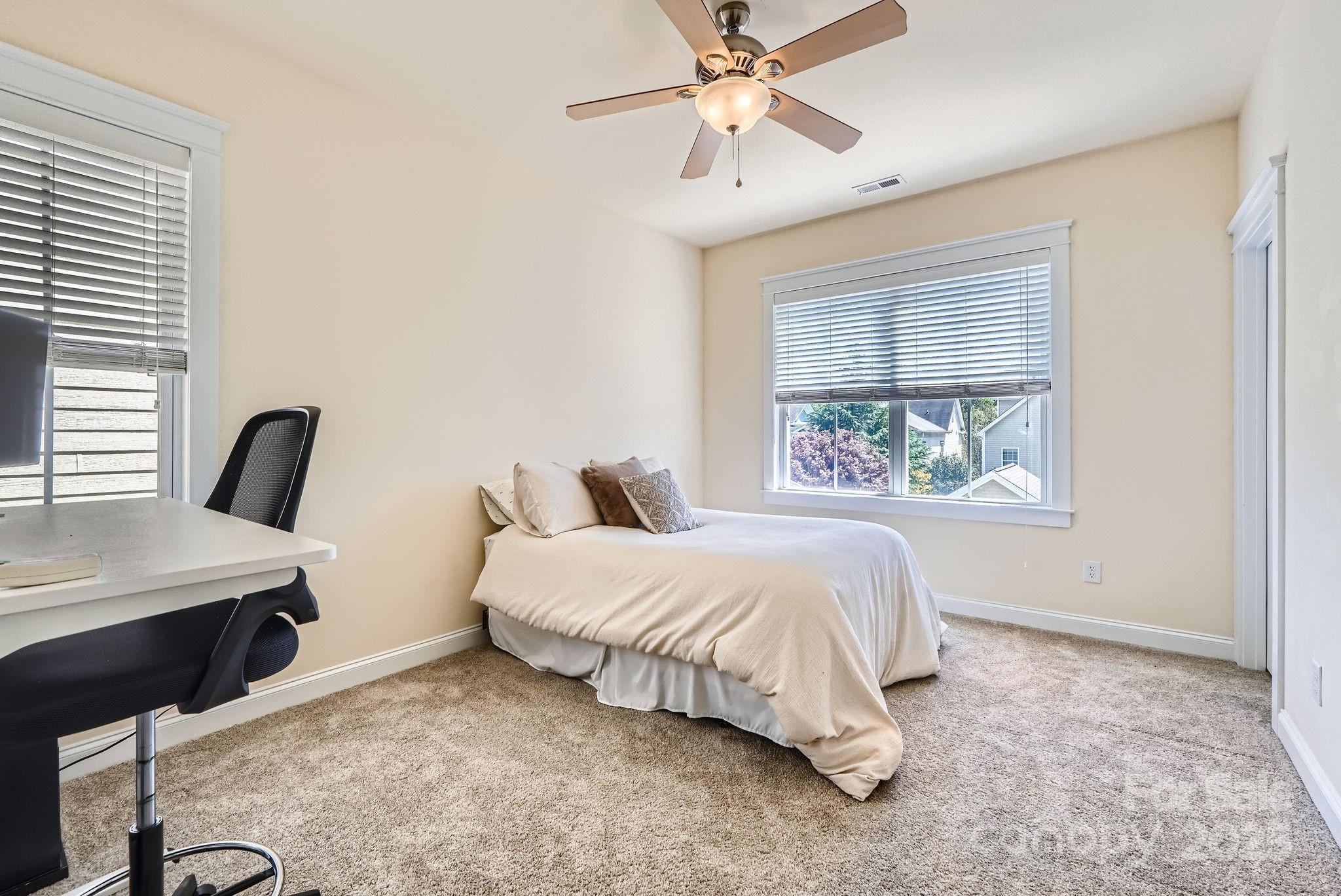 275 Bridges Farm Road Mooresville, NC 28115 - Photo 25 of 48 a bedroom with a bed and a window