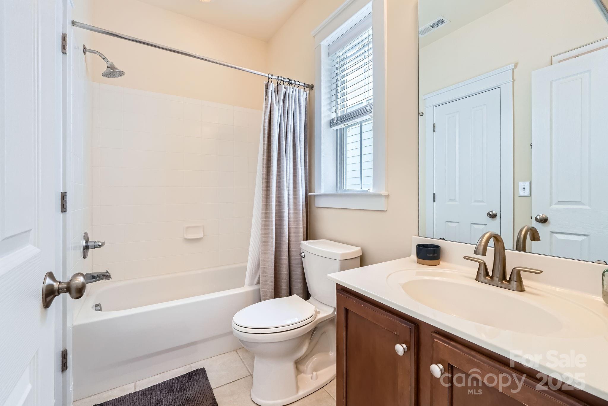 275 Bridges Farm Road Mooresville, NC 28115 - Photo 26 of 48 a bathroom with a sink a toilet and a bathtub