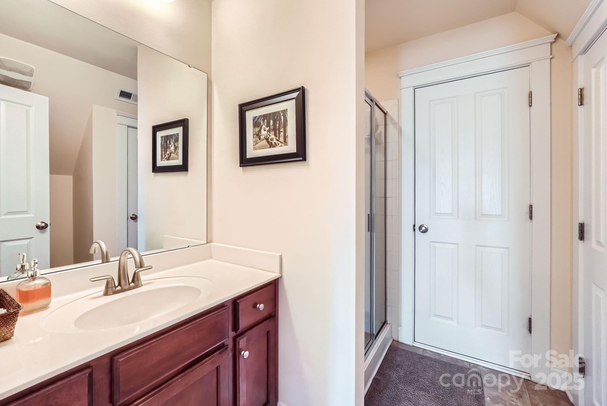 275 Bridges Farm Road Mooresville, NC 28115 - Photo 28 of 48 a bathroom with 2 sink and a mirror