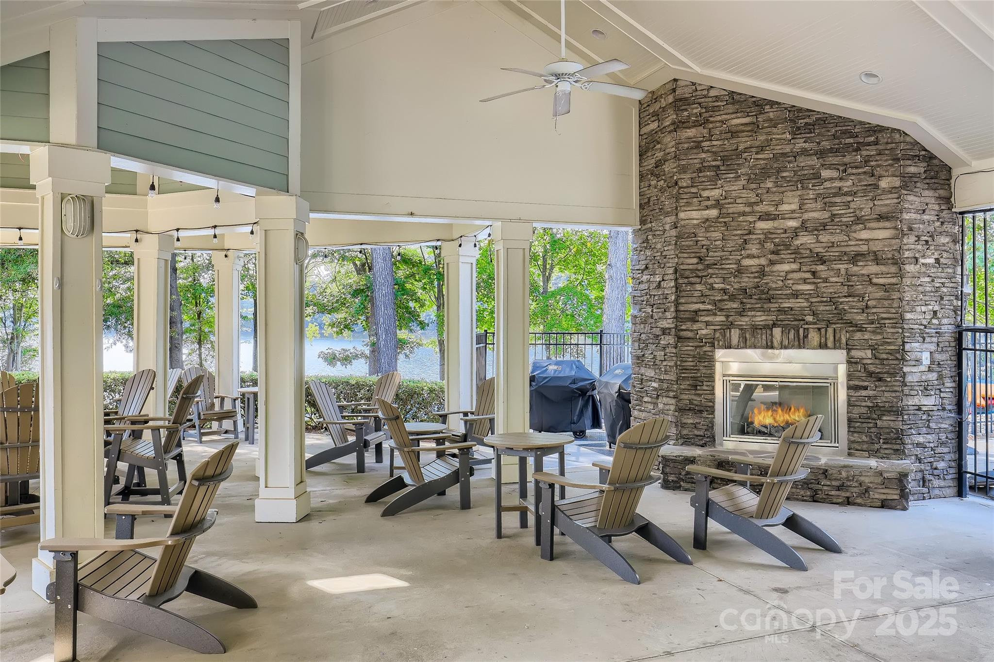 275 Bridges Farm Road Mooresville, NC 28115 - Photo 36 of 48 a living room with patio furniture and a floor to ceiling window