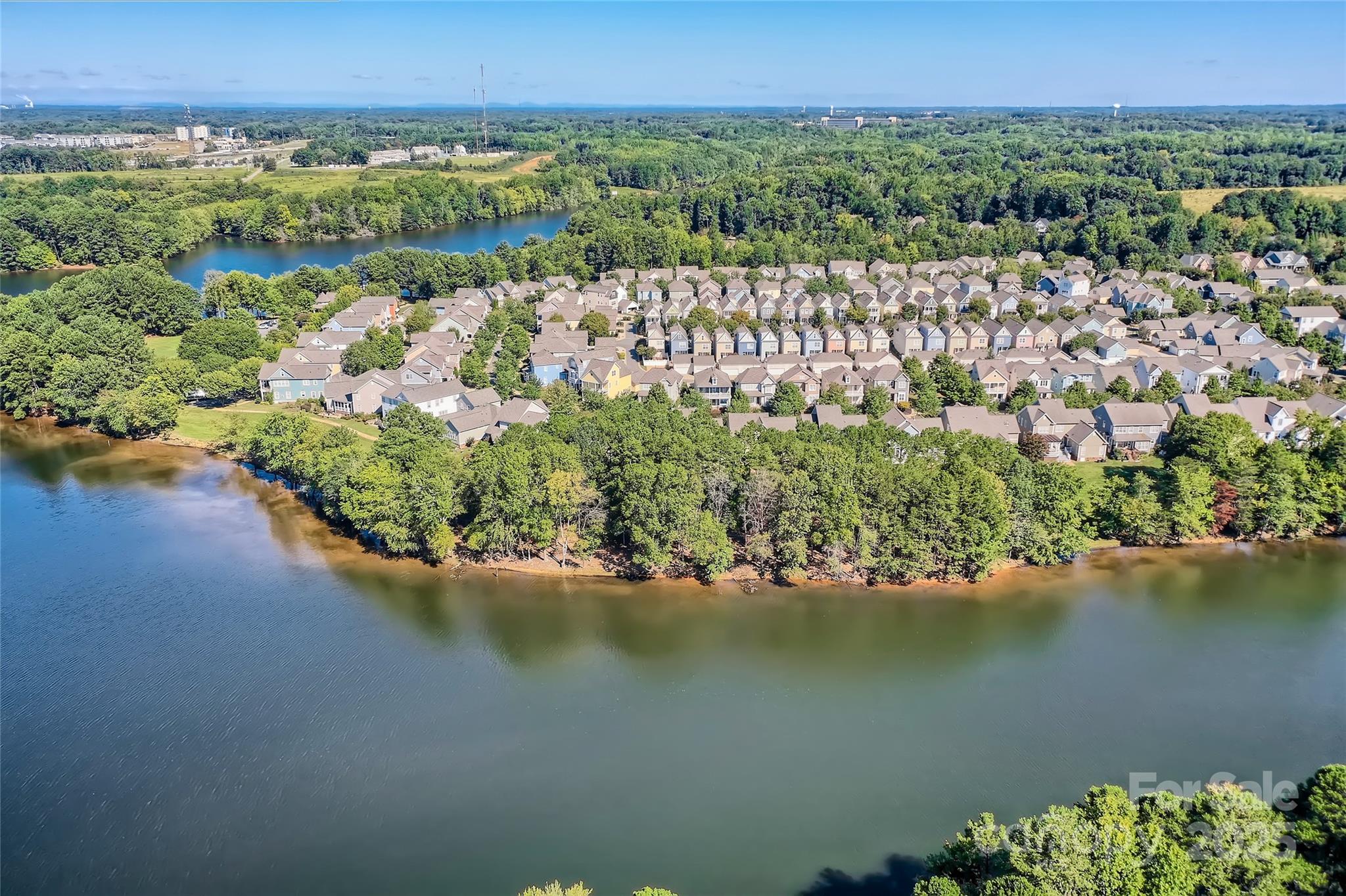 275 Bridges Farm Road Mooresville, NC 28115 - Photo 43 of 48 a view of a lake with a mountain in the background