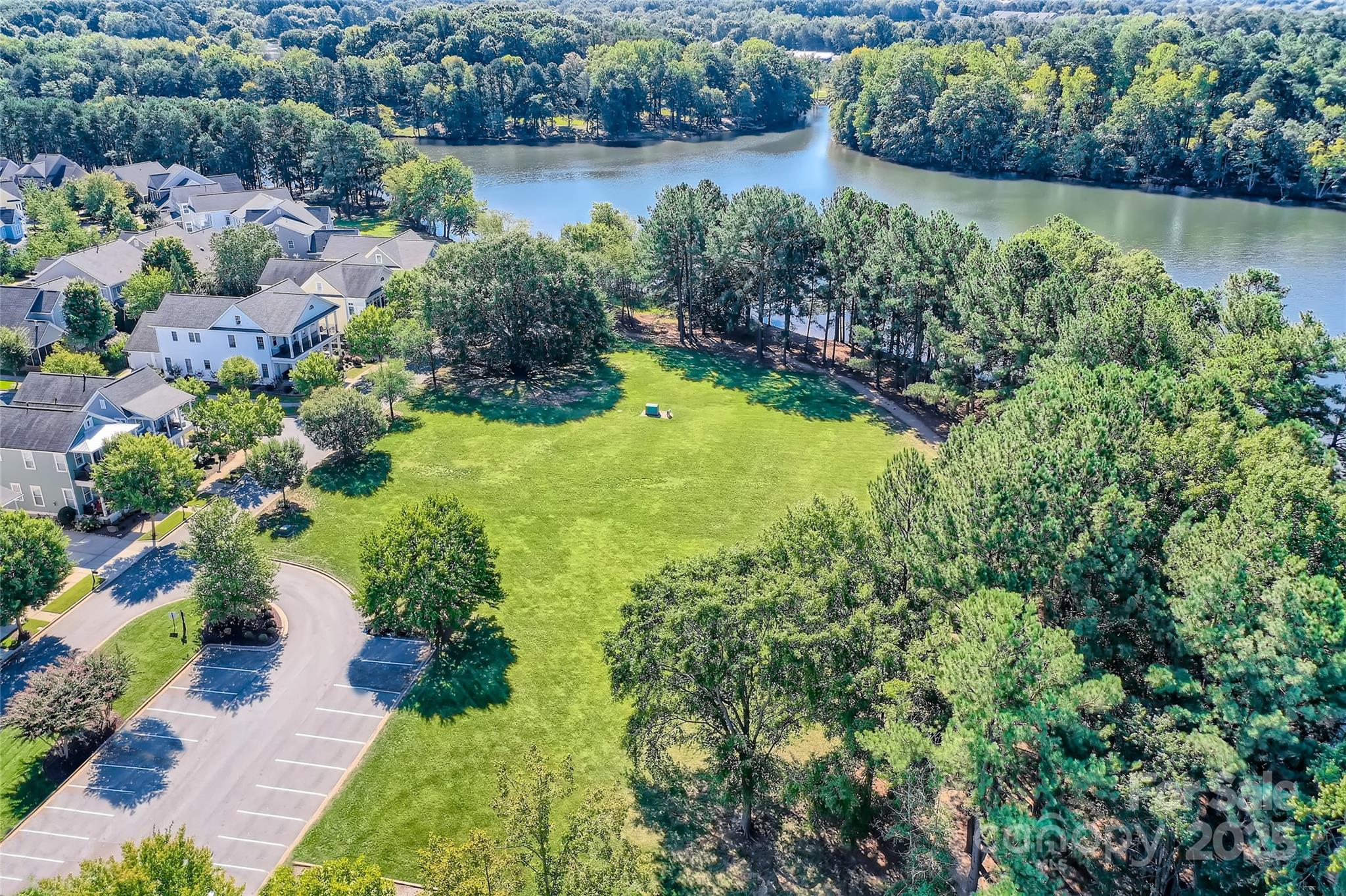 275 Bridges Farm Road Mooresville, NC 28115 - Photo 44 of 48 a view of a garden with a lake