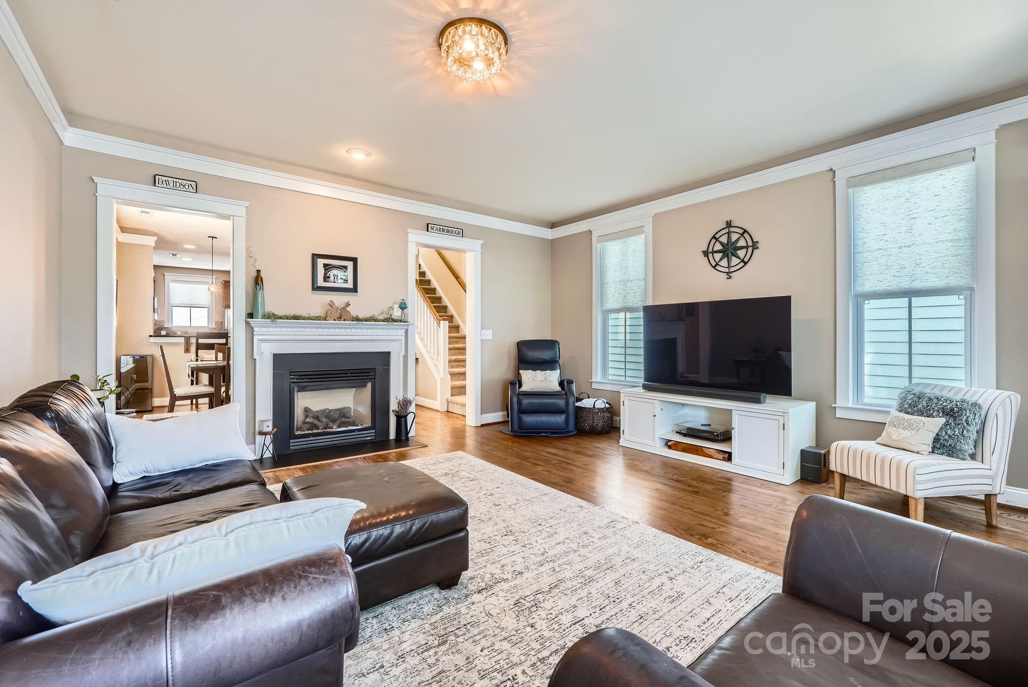 275 Bridges Farm Road Mooresville, NC 28115 - Photo 6 of 48 a living room with furniture and a flat screen tv
