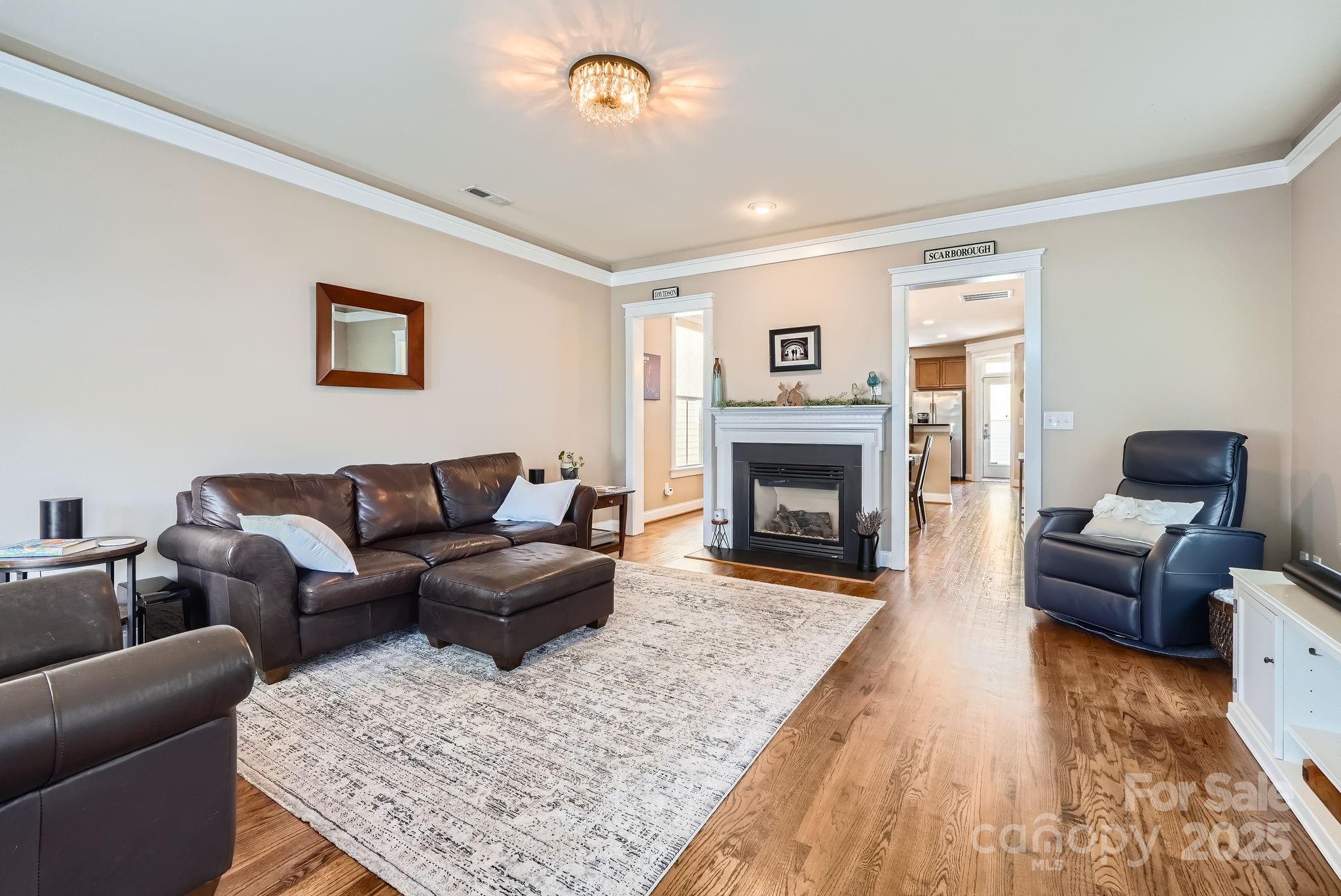 275 Bridges Farm Road Mooresville, NC 28115 - Photo 8 of 48 a living room with furniture and a fireplace