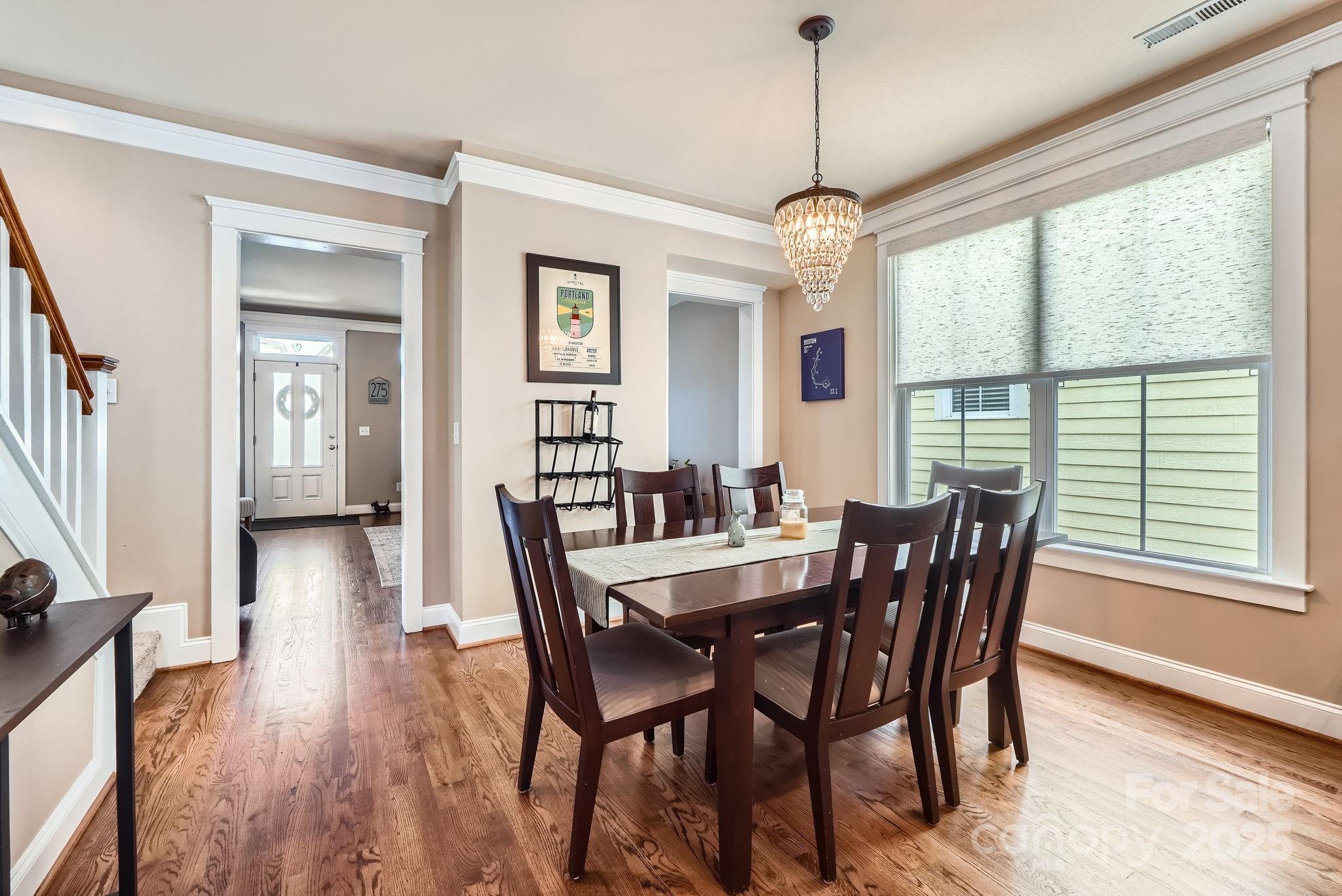 275 Bridges Farm Road Mooresville, NC 28115 - Photo 10 of 48 a view of a dining room with furniture window and wooden floor