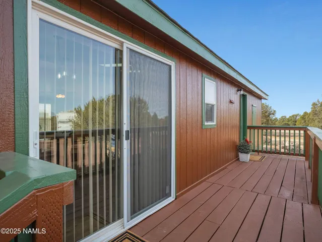 a view of backyard with a deck
