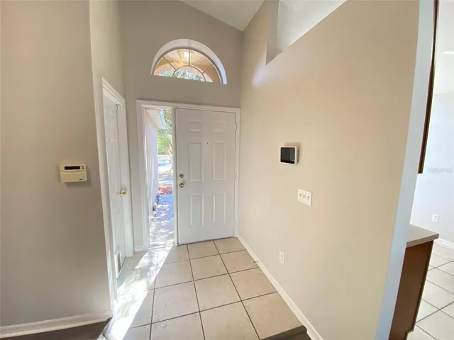 a view of a hallway with front door