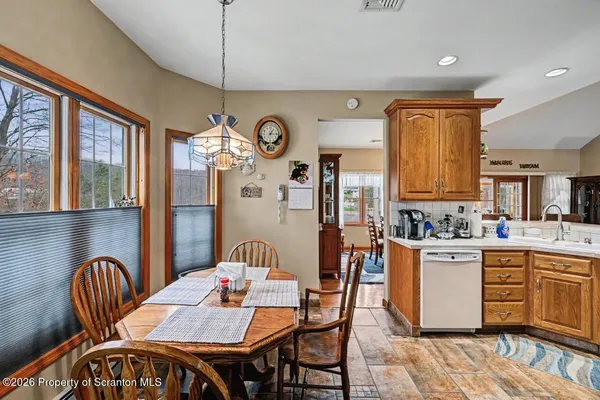 a kitchen with a refrigerator stove and sink