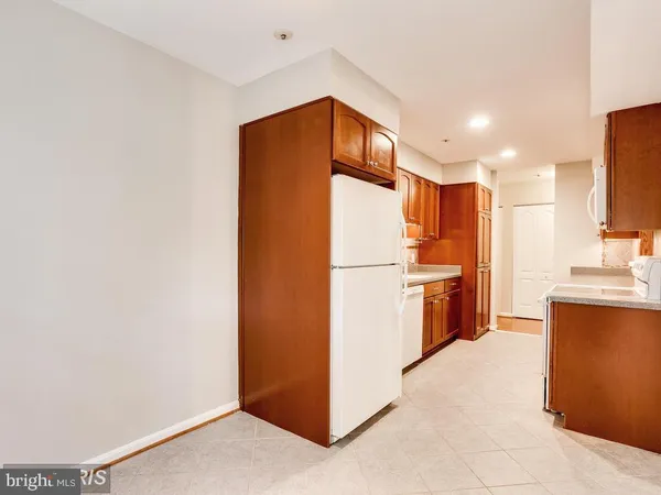 a kitchen with stainless steel appliances a refrigerator and a sink