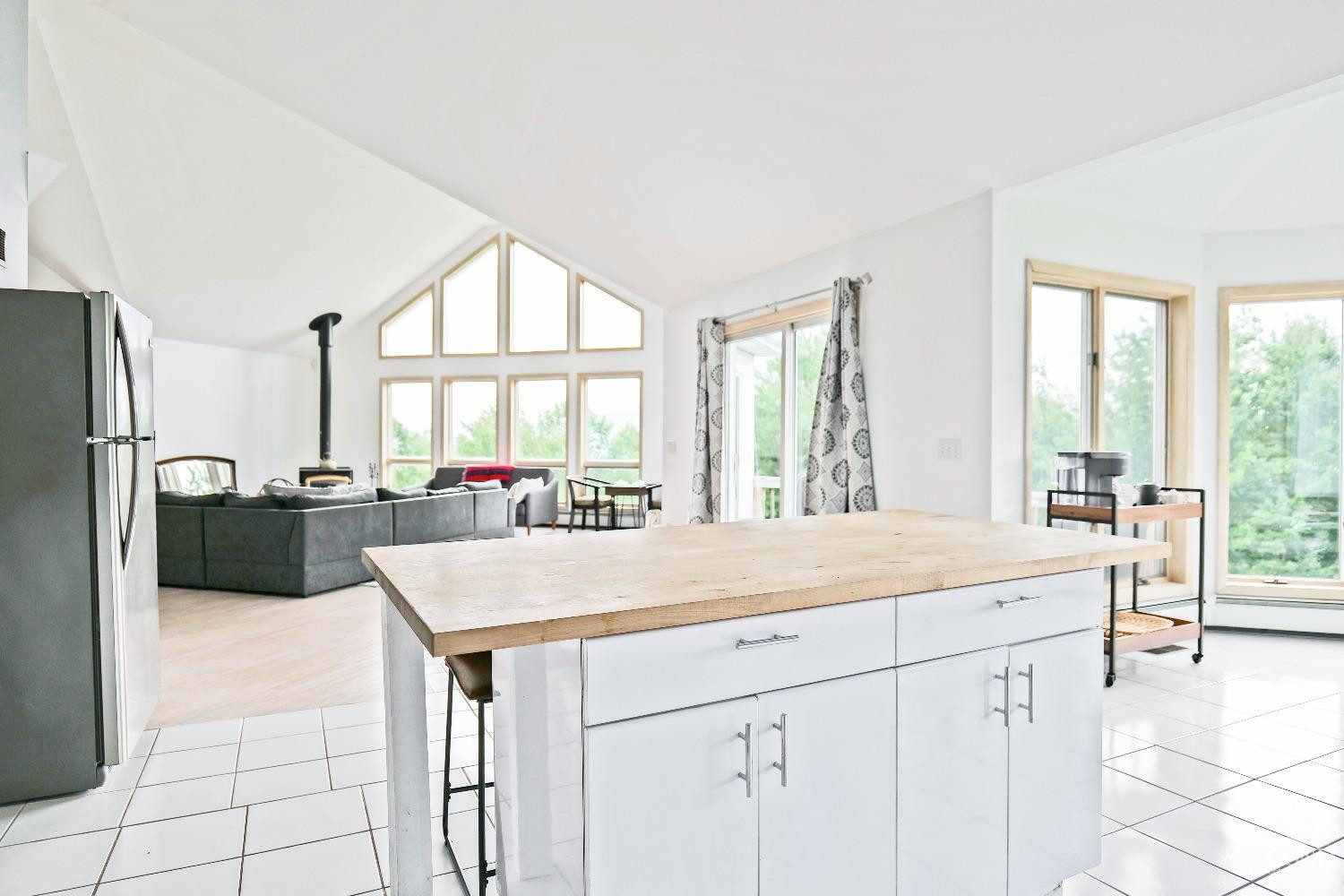 3372 County Road 10 Windham, NY 12496 - Photo 18 of 37 a dining hall with stainless steel appliances granite countertop a sink and a refrigerator