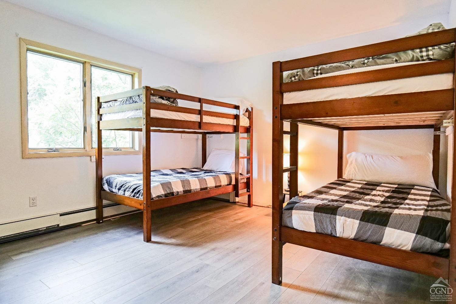 3372 County Road 10 Windham, NY 12496 - Photo 24 of 37 a bedroom with a bed and a window