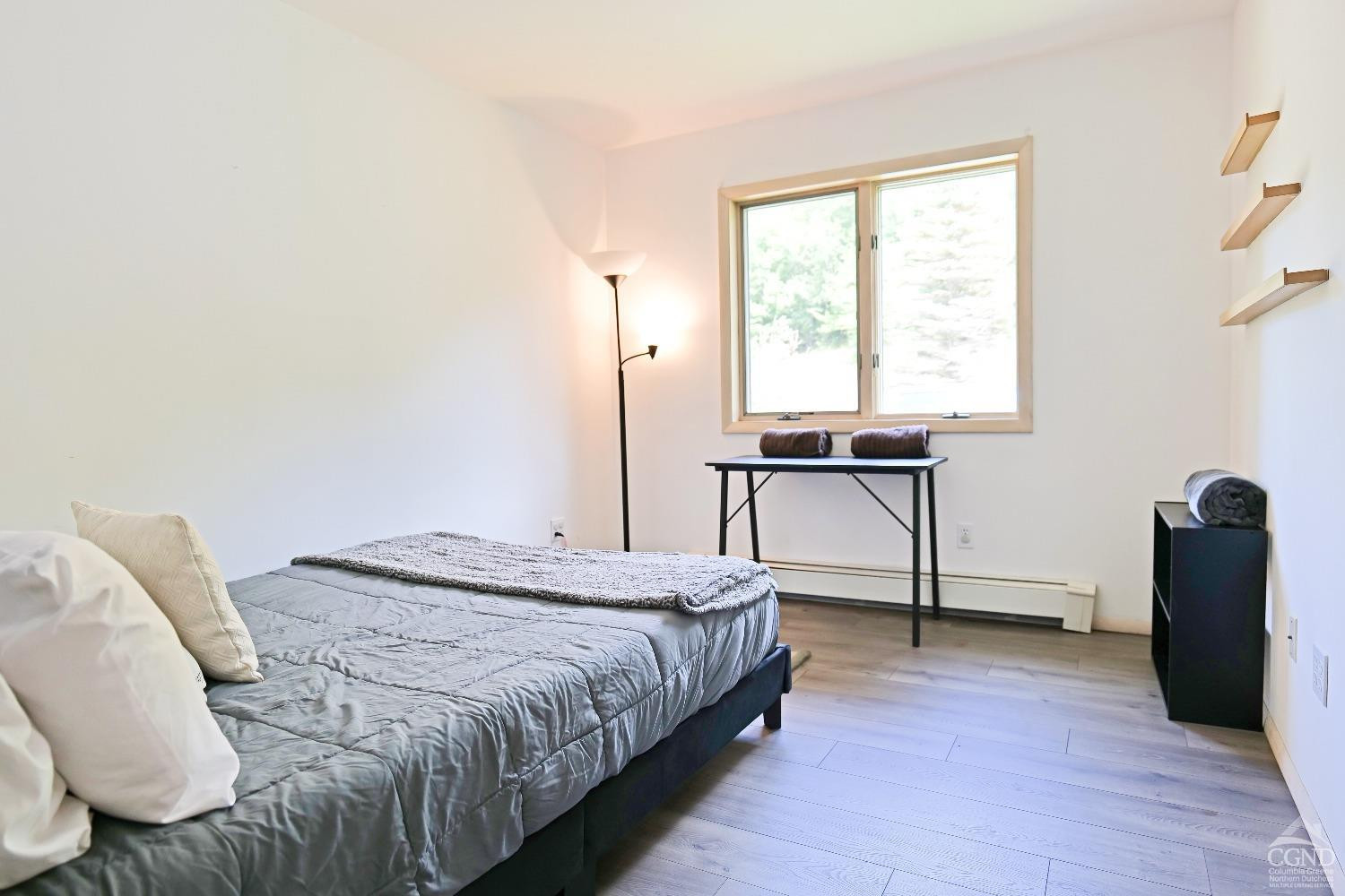 3372 County Road 10 Windham, NY 12496 - Photo 26 of 37 a bedroom with a bed and a window