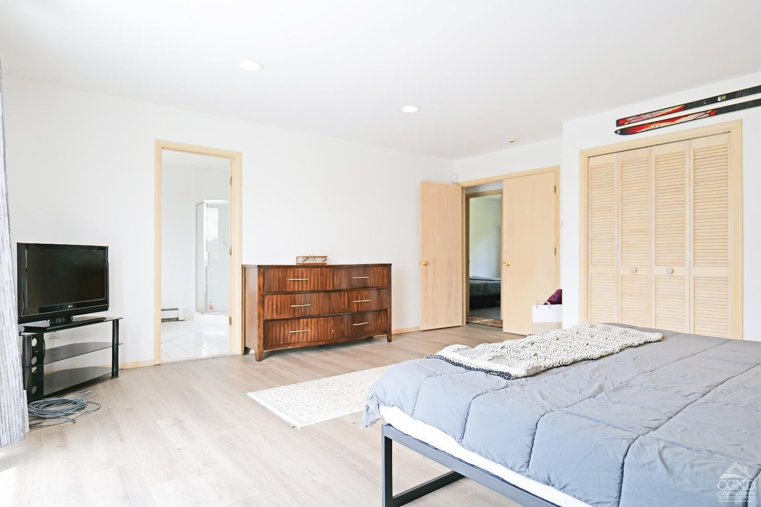 3372 County Road 10 Windham, NY 12496 - Photo 28 of 37 a bedroom with a bed and flat screen tv