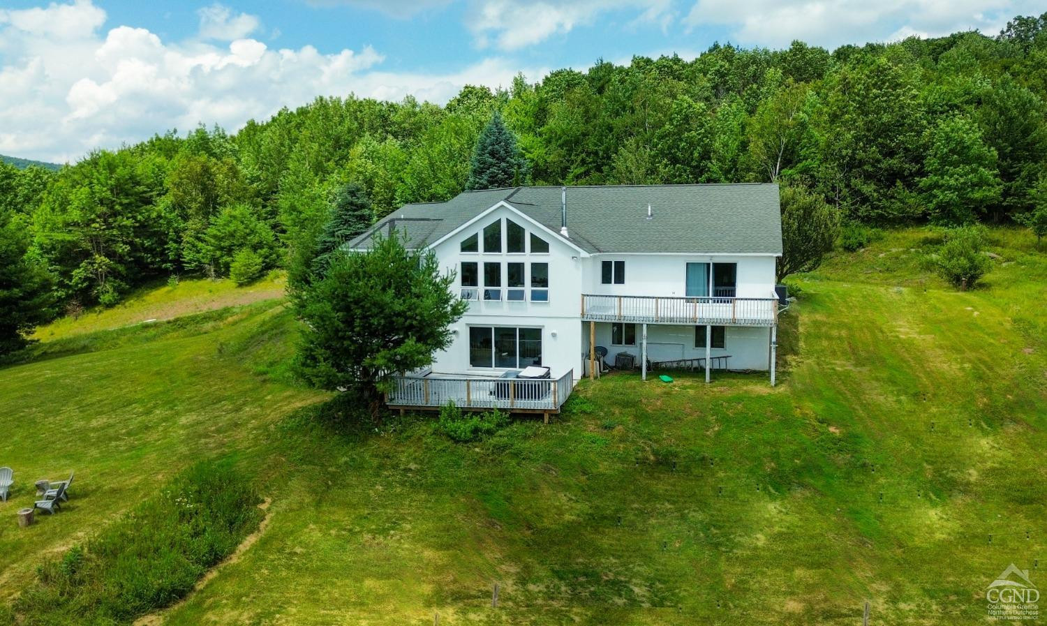 3372 County Road 10 Windham, NY 12496 - Photo 3 of 37 a front view of a house with a yard