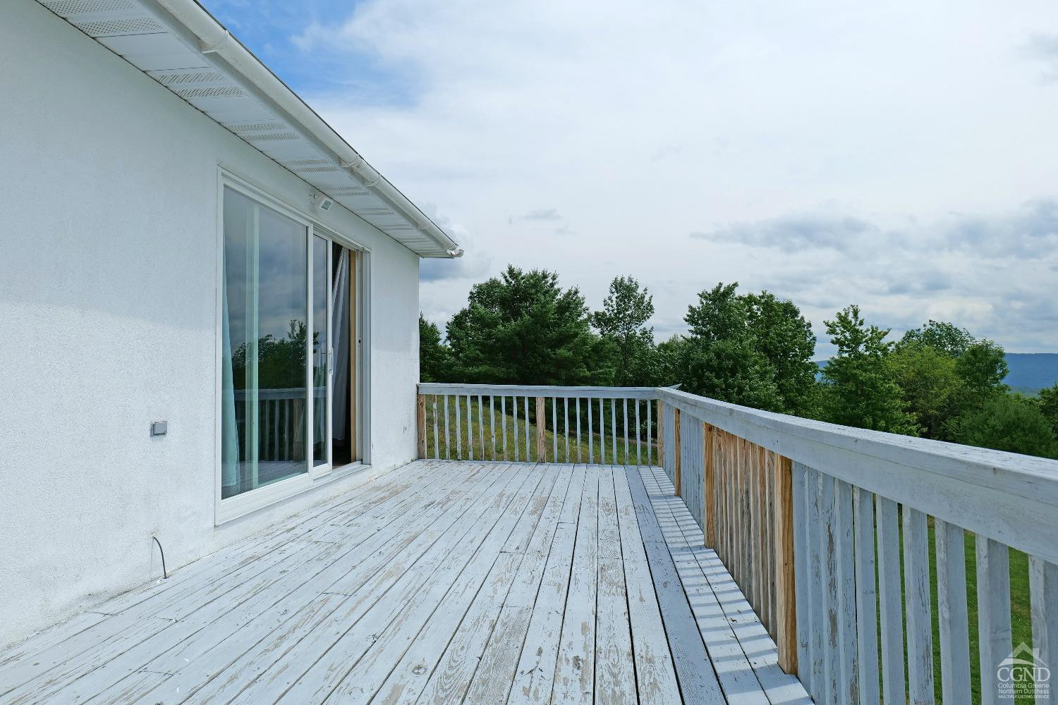 3372 County Road 10 Windham, NY 12496 - Photo 31 of 37 a balcony with wooden floor and fence