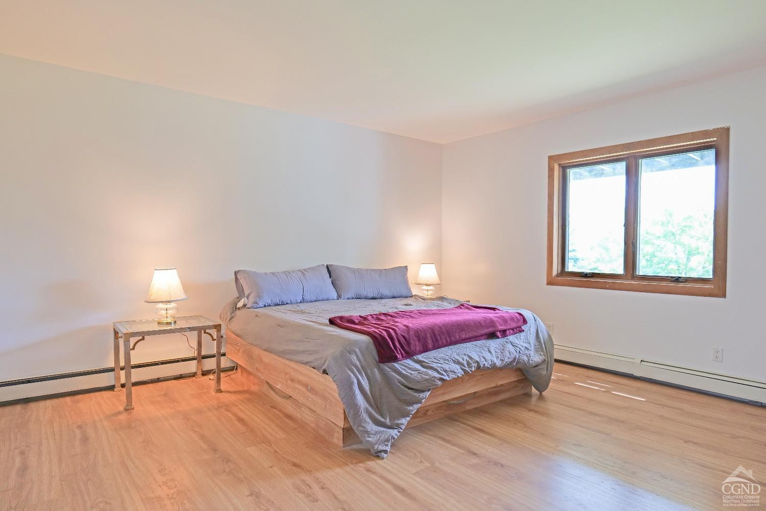 3372 County Road 10 Windham, NY 12496 - Photo 33 of 37 a bedroom with a bed and a window