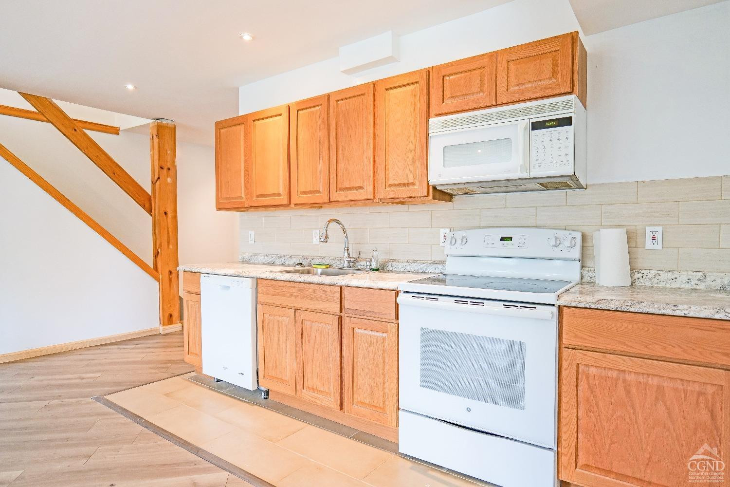 3372 County Road 10 Windham, NY 12496 - Photo 35 of 37 a kitchen with granite countertop a sink and cabinets