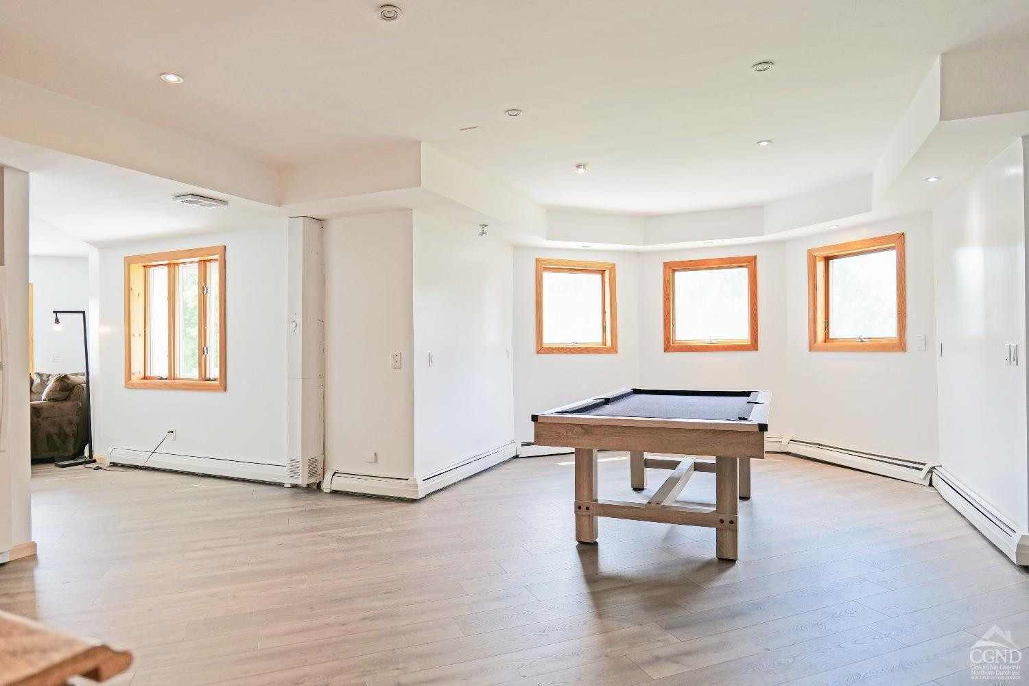 3372 County Road 10 Windham, NY 12496 - Photo 37 of 37 an empty room with wooden floor and windows