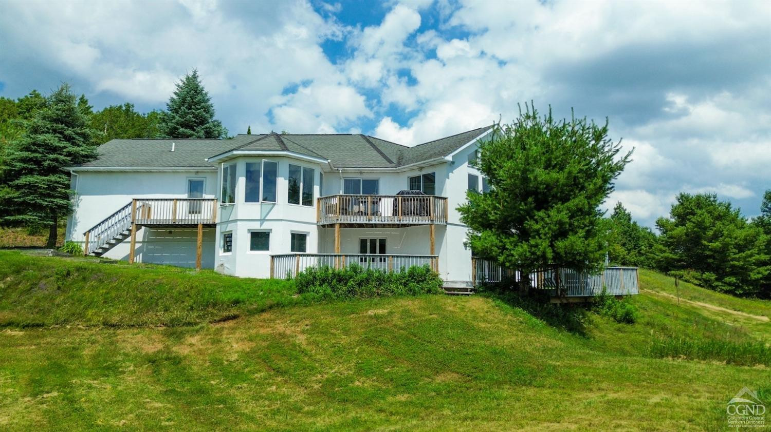 3372 County Road 10 Windham, NY 12496 - Photo 4 of 37 a front view of a house with a garden