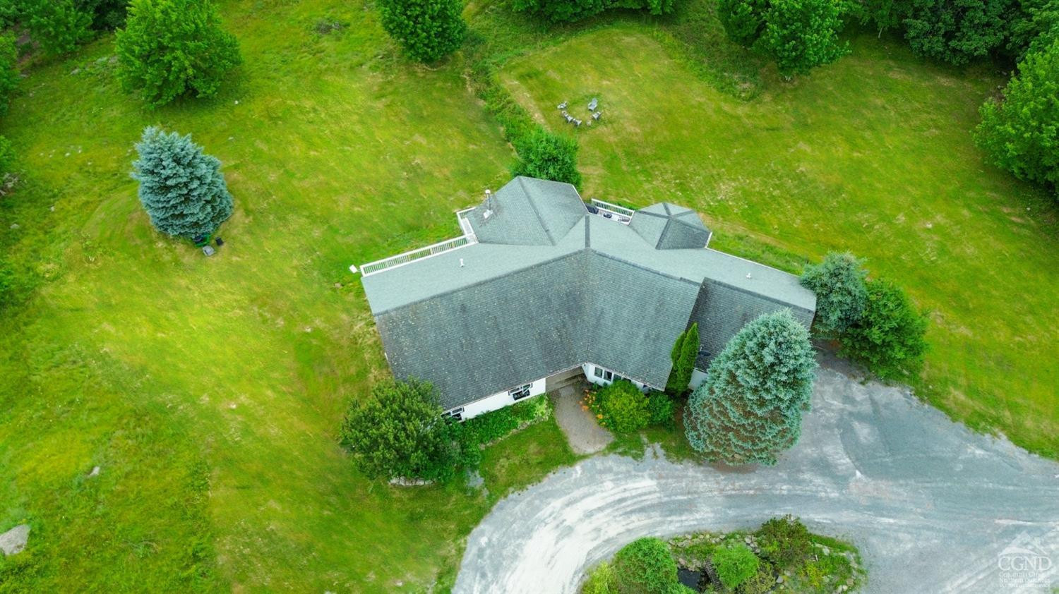 3372 County Road 10 Windham, NY 12496 - Photo 7 of 37 a view of a garden with a fountain