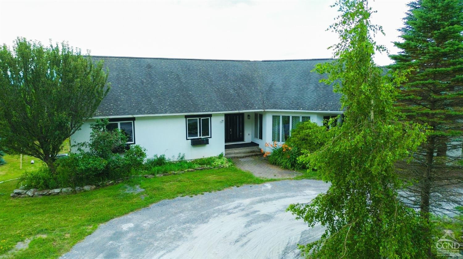 3372 County Road 10 Windham, NY 12496 - Photo 8 of 37 a front view of a house with a garden