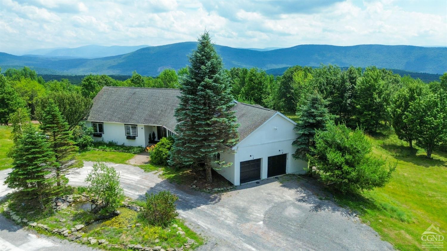 3372 County Road 10 Windham, NY 12496 - Photo 9 of 37 a view of a house with a yard and a large tree