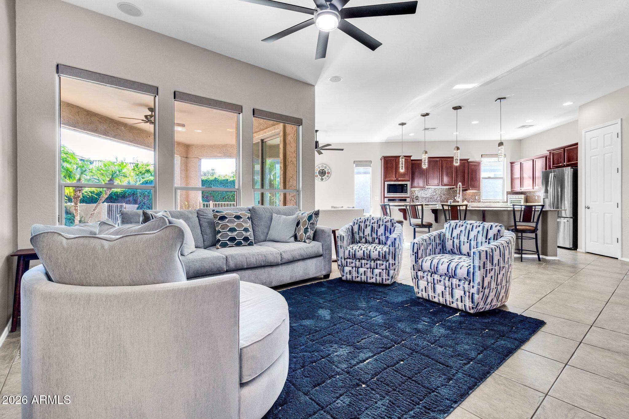 5333 South Marigold Way Gilbert, AZ 85298 - Photo 12 of 69 a living room with furniture and a large window