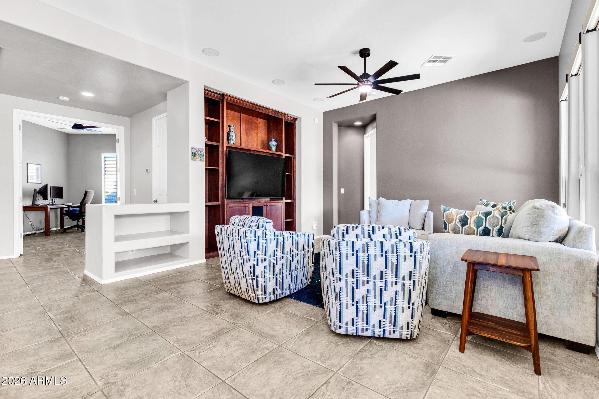 5333 South Marigold Way Gilbert, AZ 85298 - Photo 14 of 69 a living room with furniture and a flat screen tv